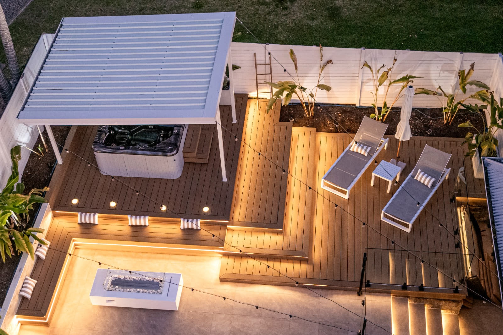 Multi-level deck with under-step lighting at night